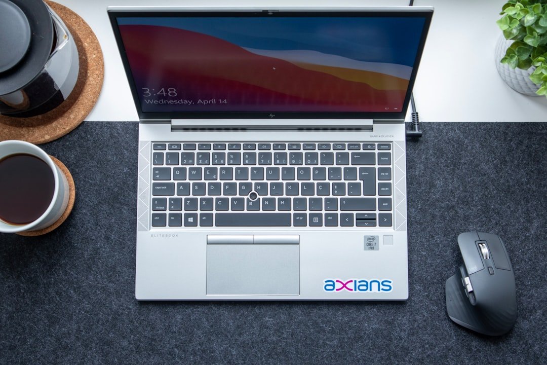 macbook pro on gray textile