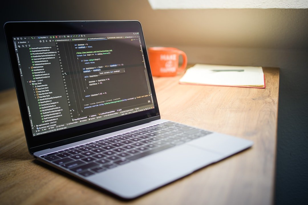 Laptop screen displaying code with a mug nearby.