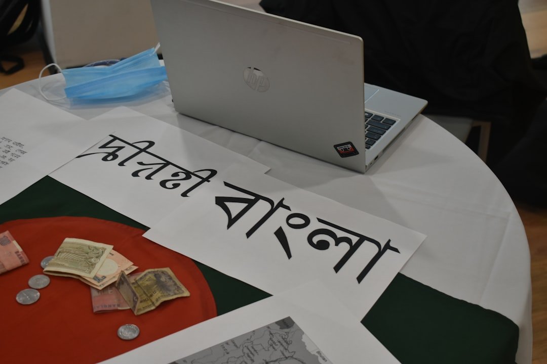 Bengali text and currency on a table