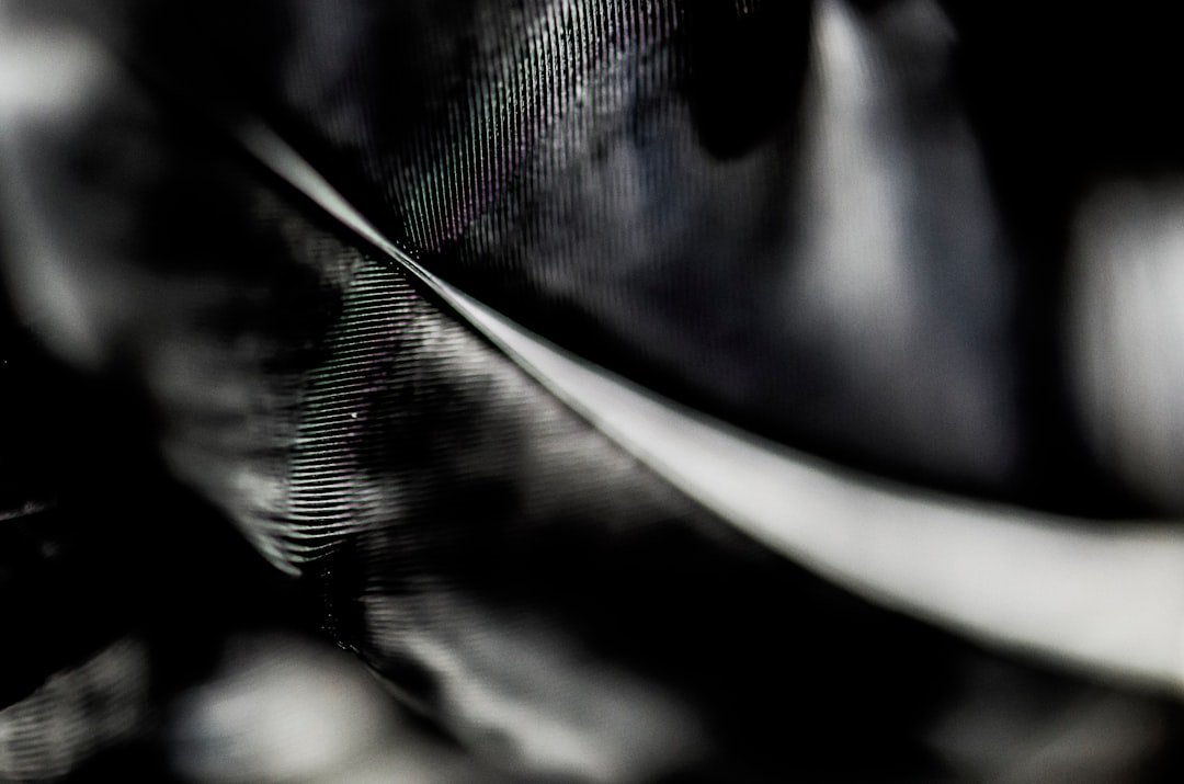 Abstract dark swirls with colorful light reflections